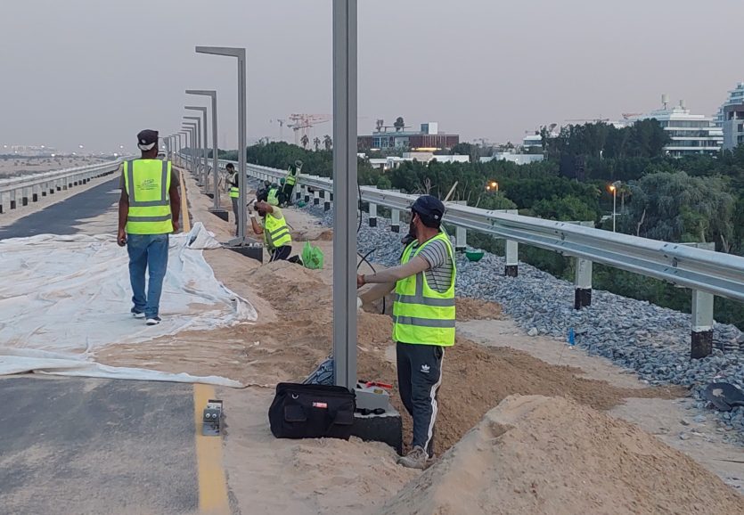 Power Poles Team On Site Installing Street Lights