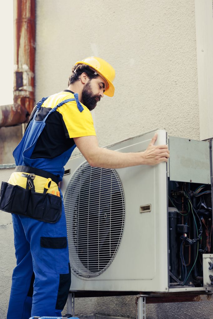 Technician performing HVAC installation for commercial building in Dubai