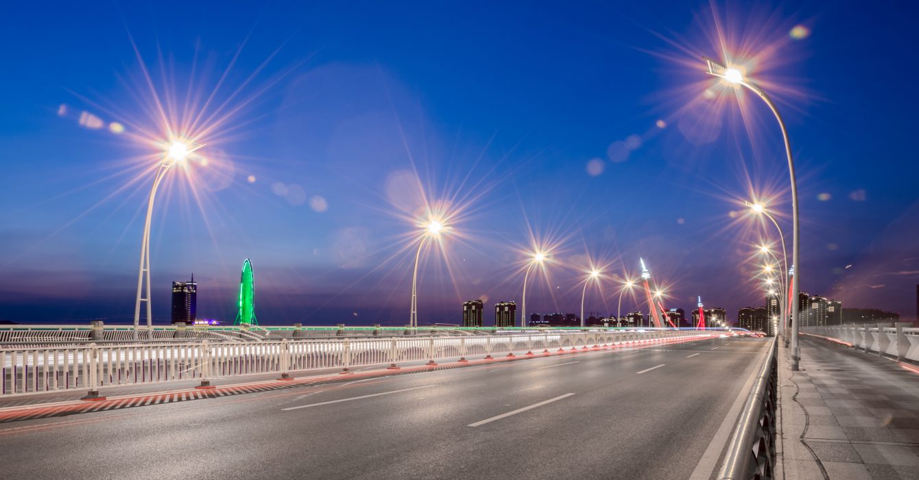 Smart Solar Street Lighting in UAE by Power Poles Electromechanical Solar-powered LED street lighting poles installed along a highway in UA